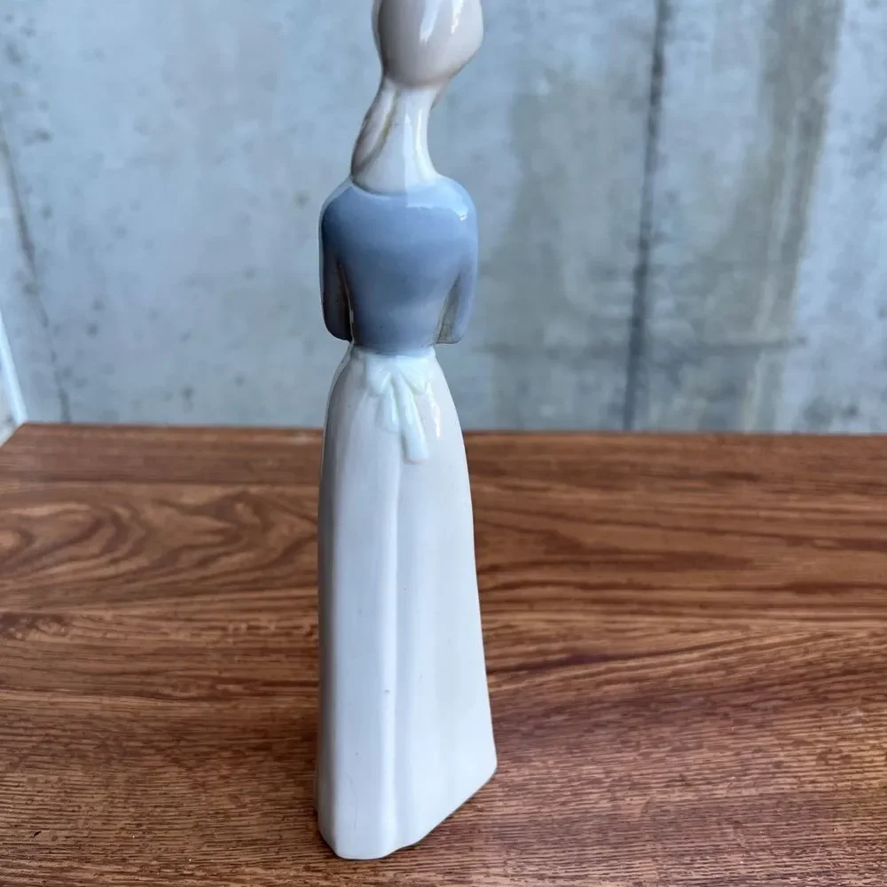 Porcelain Pheasant Lady Holding A Jug Good Condition